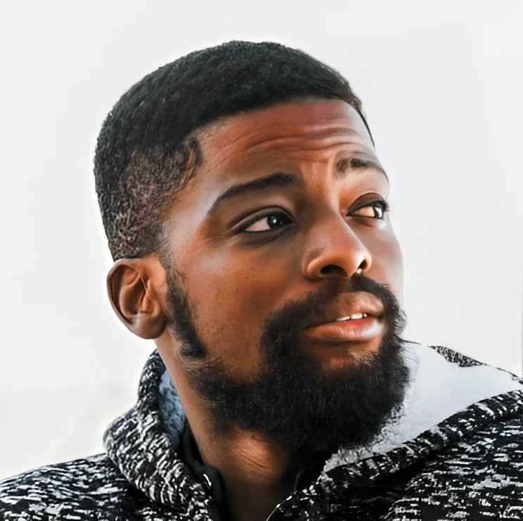Portrait of Timmy, in a black and white hoodie.