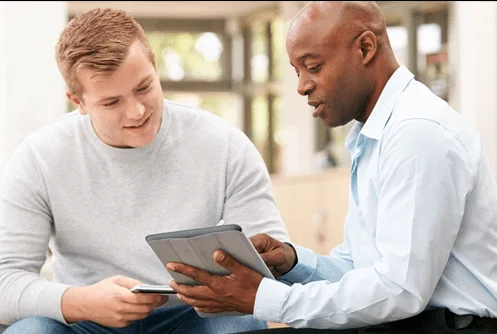 Ryan talking with the owner of a coaching business.